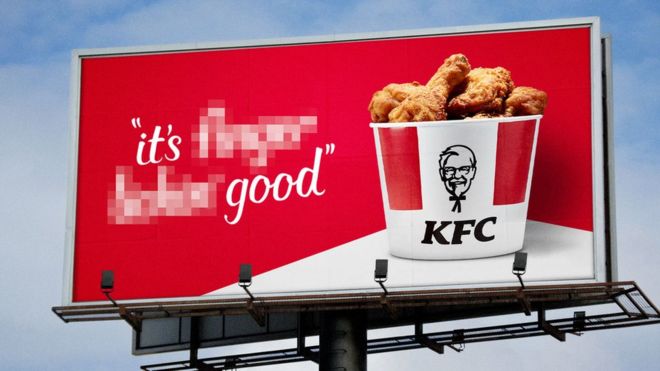 KFC poster showing “finger lickin′” pixellated out